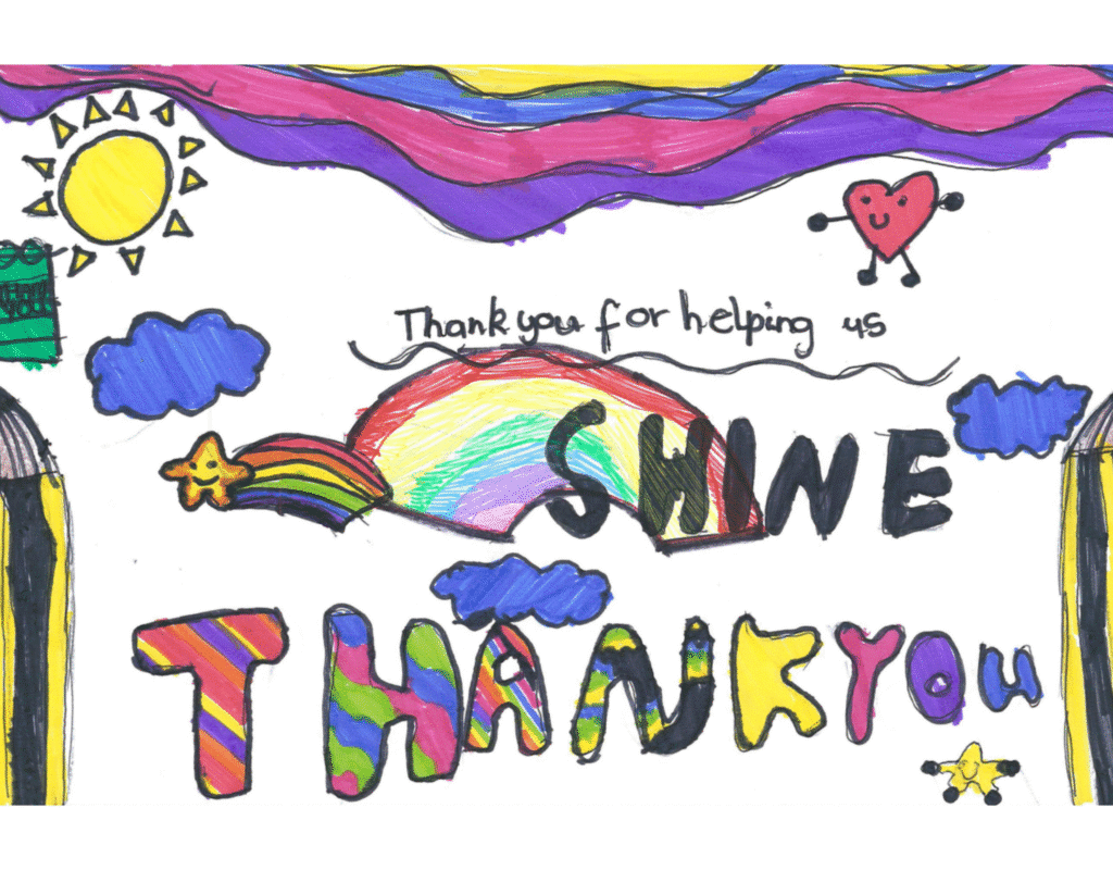 A multicoloured picture of a pupil's drawing competition entry. The picture's note reads, 'Thank you for helping us, shine, thank you' and features a sun, heart, clouds and stars.