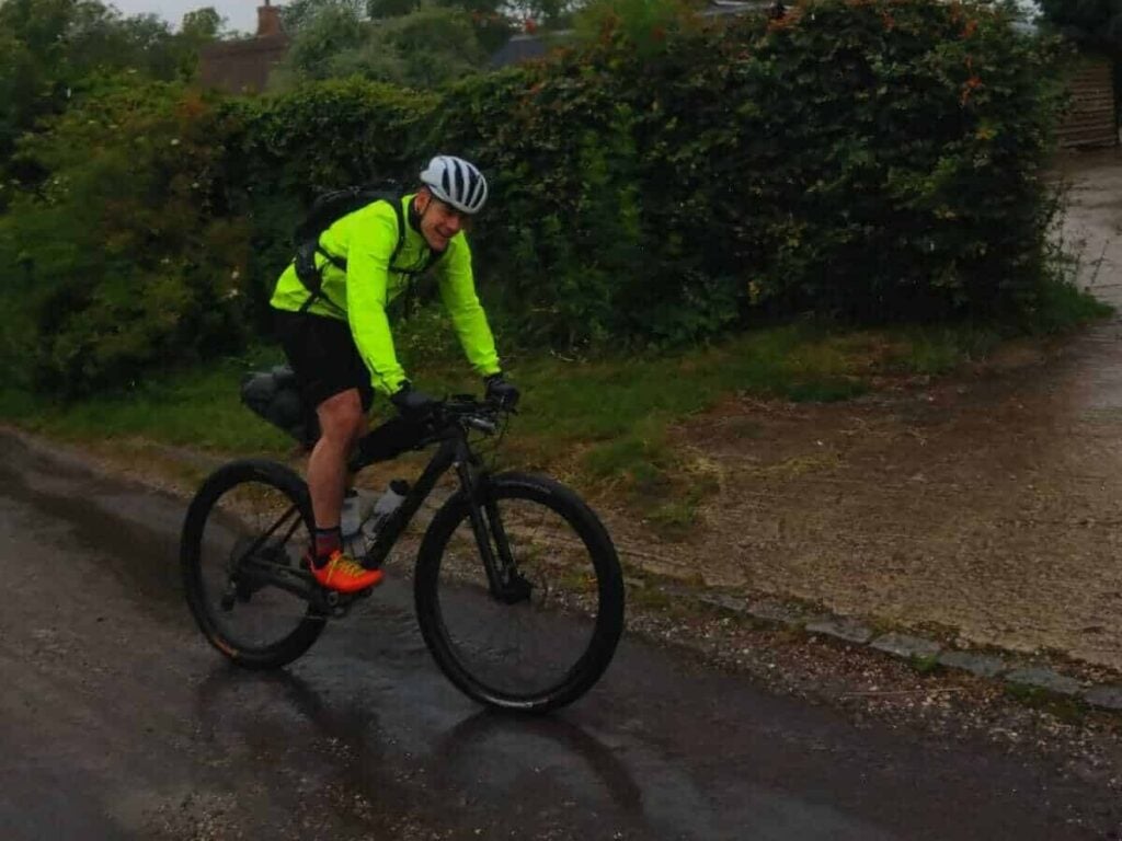Nich on a bike, smiling at the camera